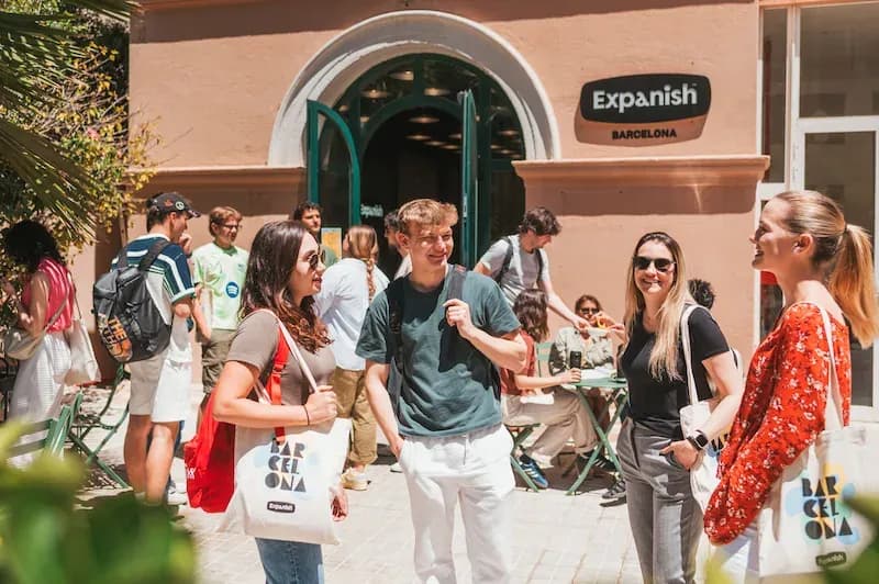 Group of adult students gathered at the entrance of Expanish Barcelona.